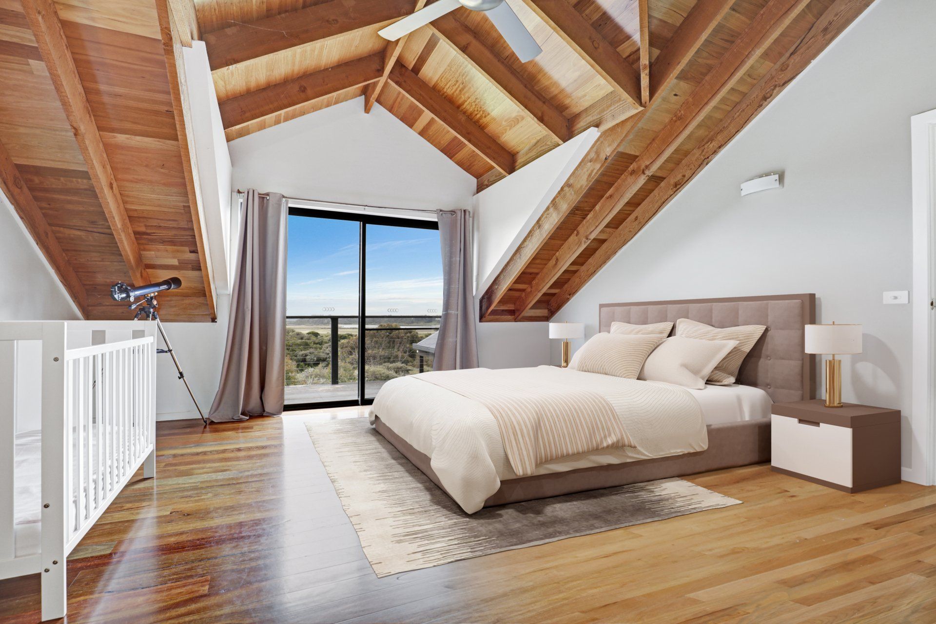 A bedroom with a large bed and a ceiling fan.