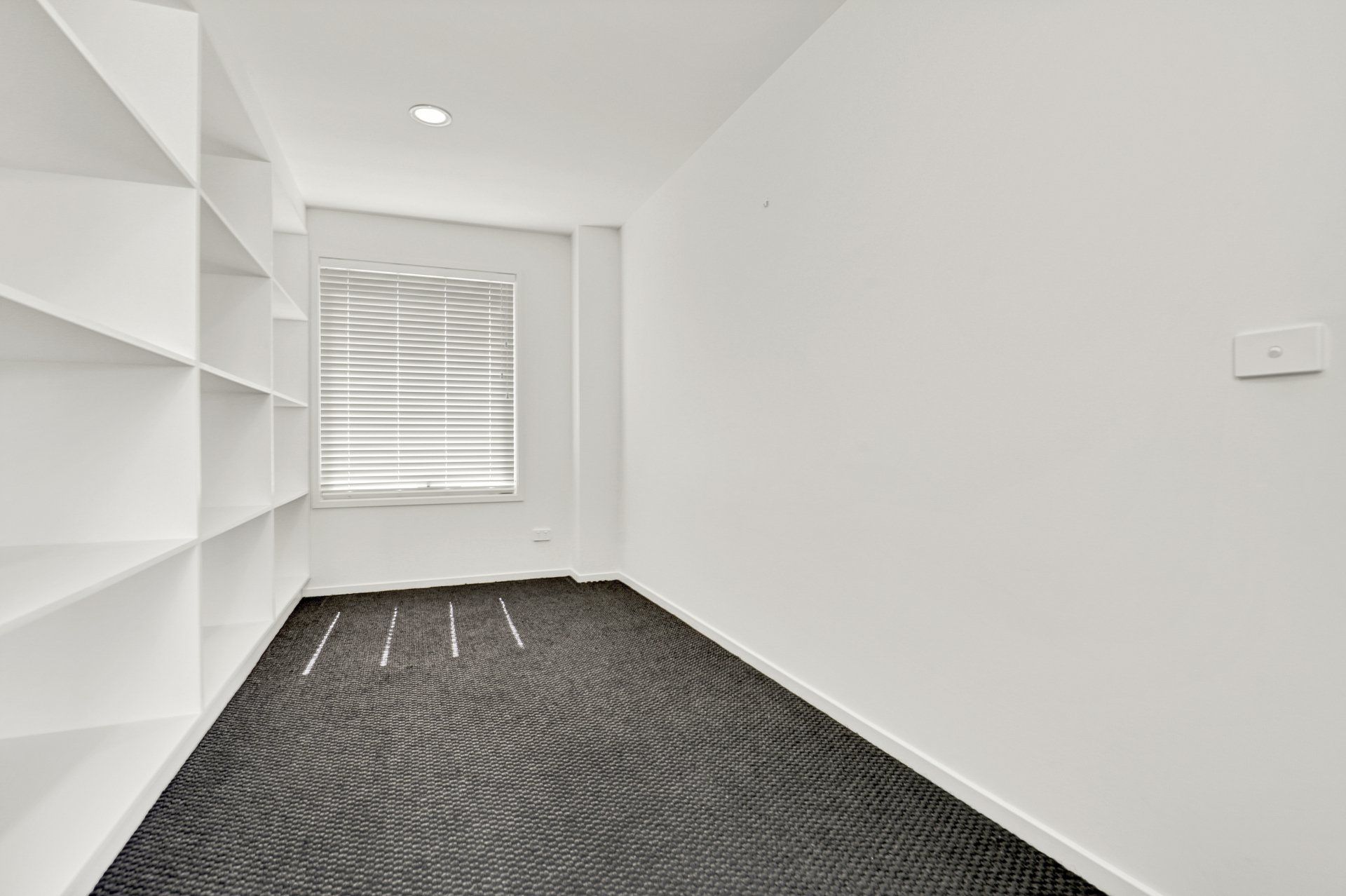 There is a window in the middle of the room.