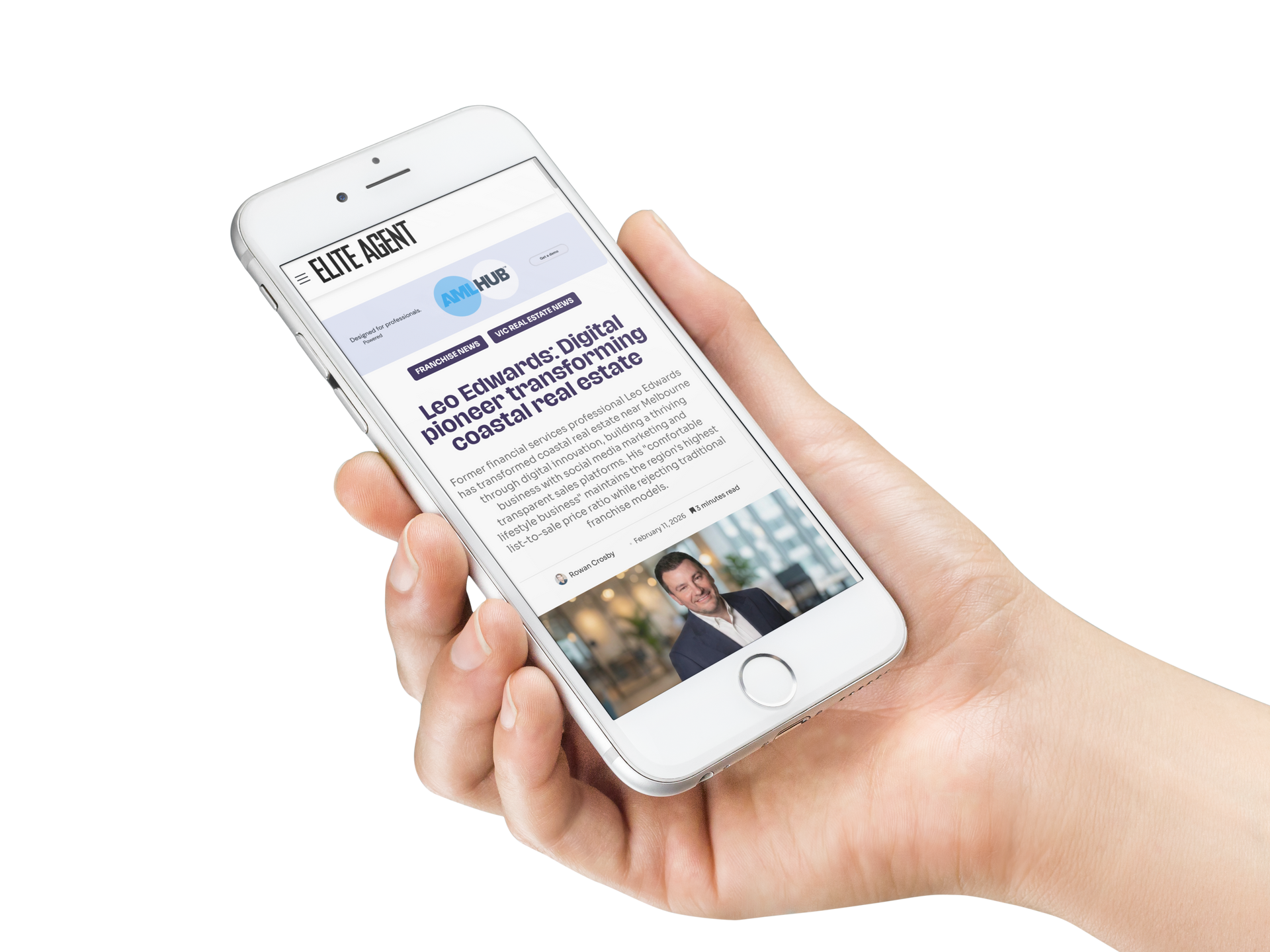 Hand holding a white smartphone showing a news article on the screen