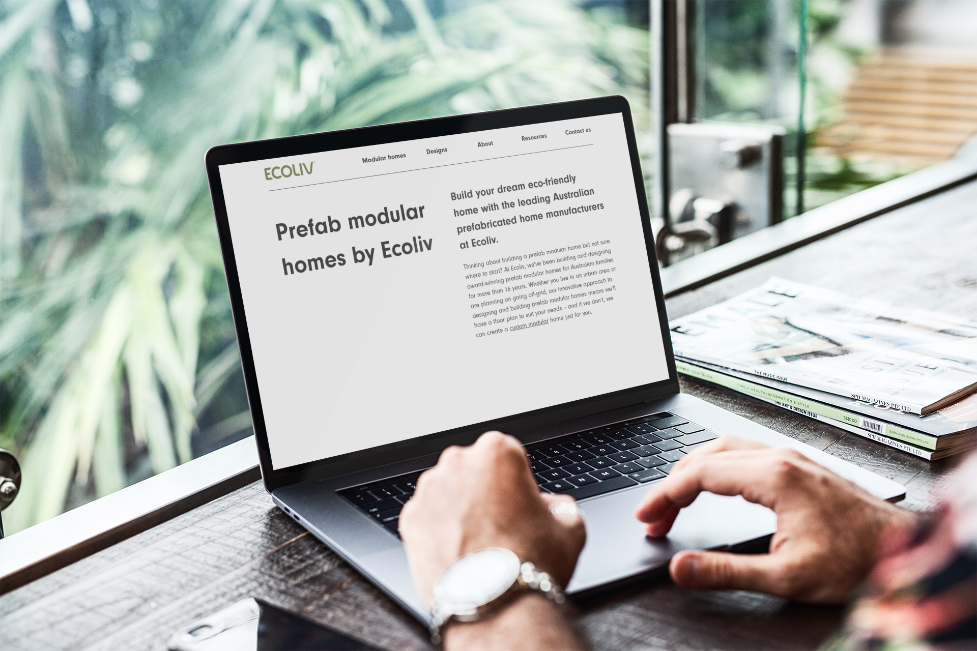 Person using laptop, viewing website for