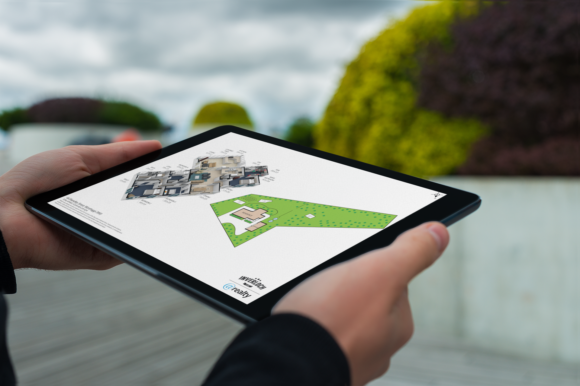 A person is holding a tablet with a map on it.