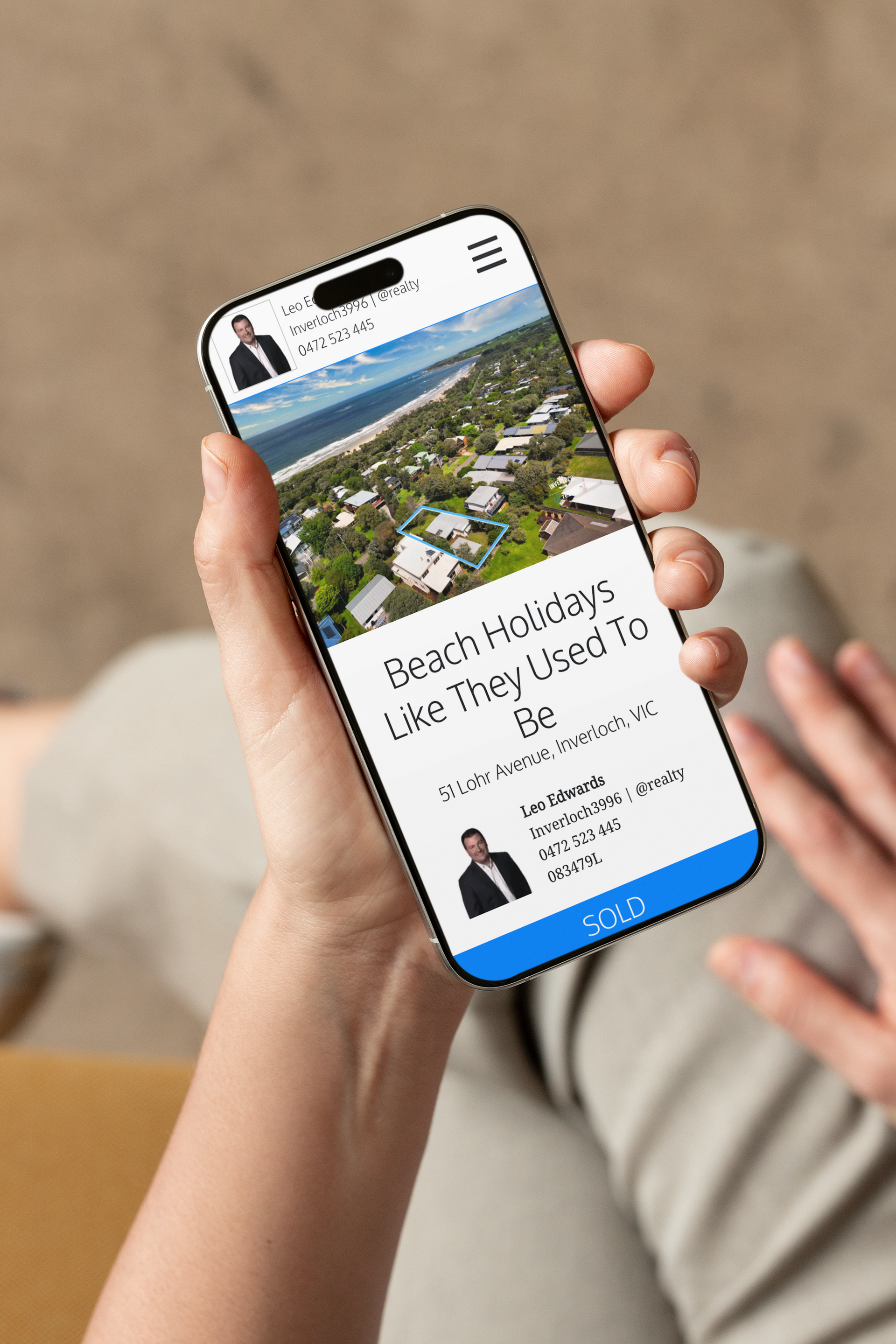 A person is holding a cell phone in their hand.