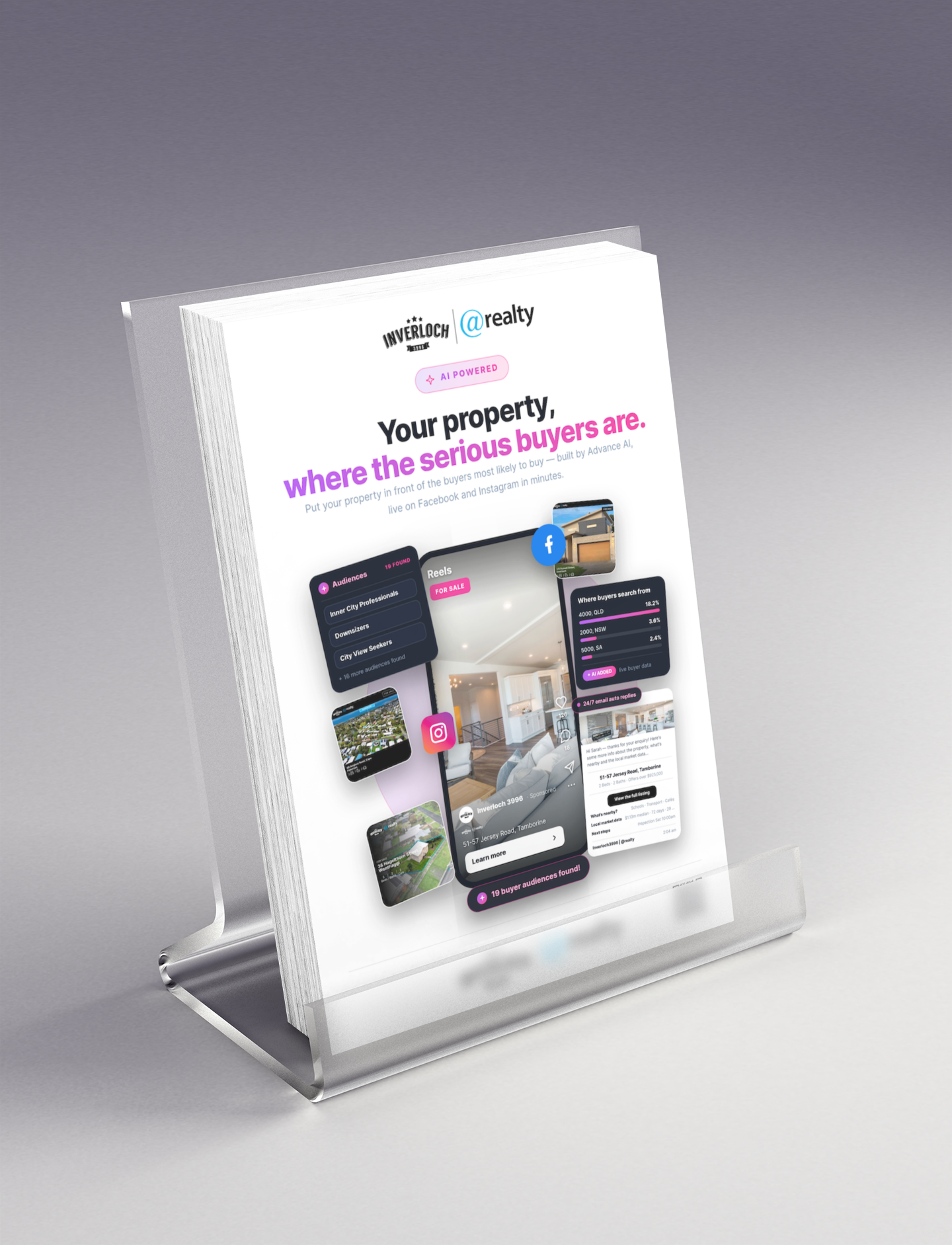 Clear acrylic brochure holder displaying a real estate flyer with purple text and property images