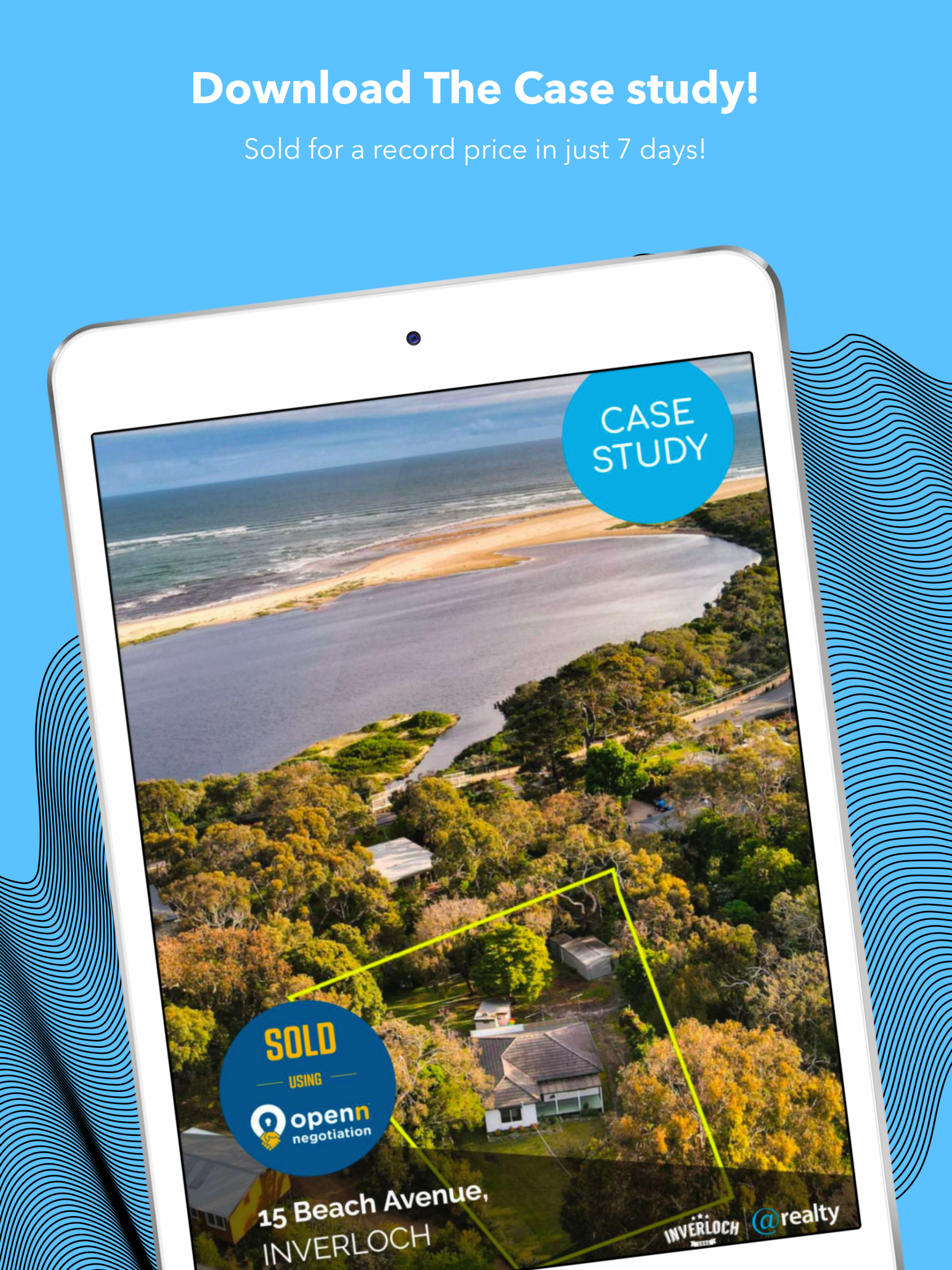 A tablet with an aerial view of a house on the beach
