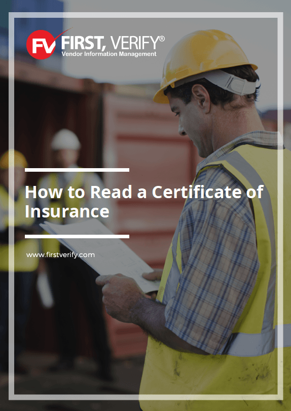 A man in a hard hat is reading a certificate of insurance