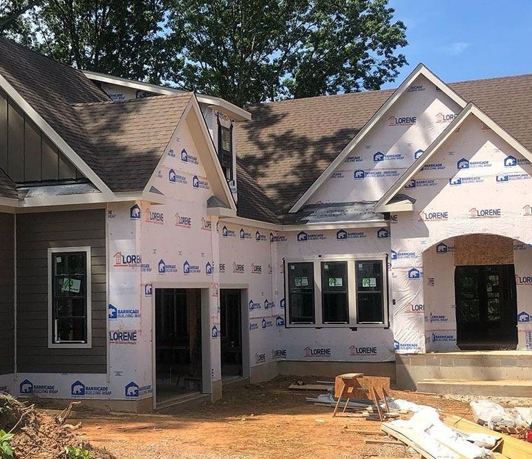 Custom home framing and house wrap installation on a build-on-your-lot project by Raye Construction in Chatham County NC