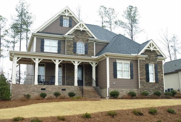 Build on your lot custom home with dark siding and wide front porch in Chatham County NC