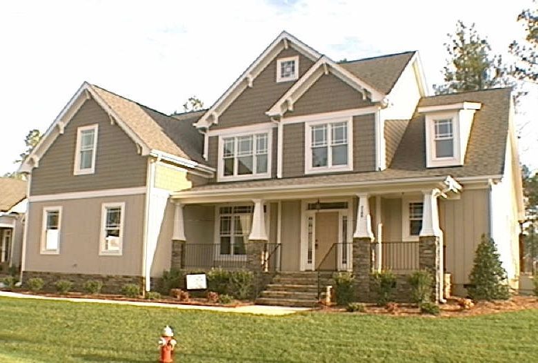 Custom home featuring board and batten siding with stone column bases built in Pittsboro NC