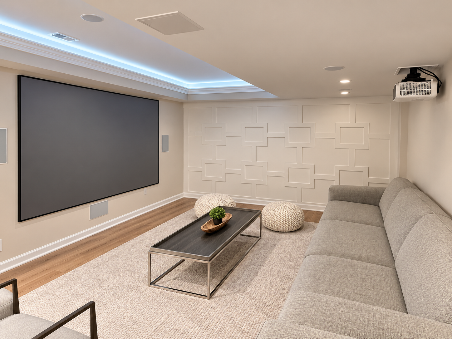Modern living room with gray sectional, coffee table, wall-mounted TV, and blue LED ceiling lighting