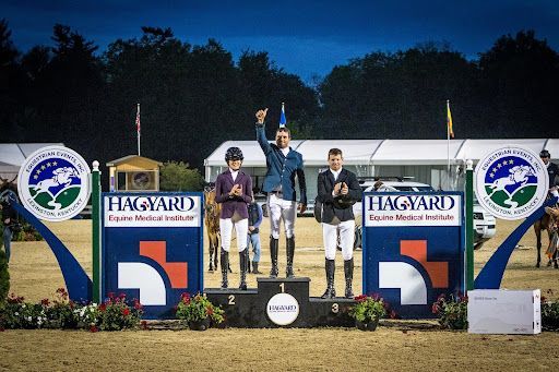 A group of people standing on top of a podium.