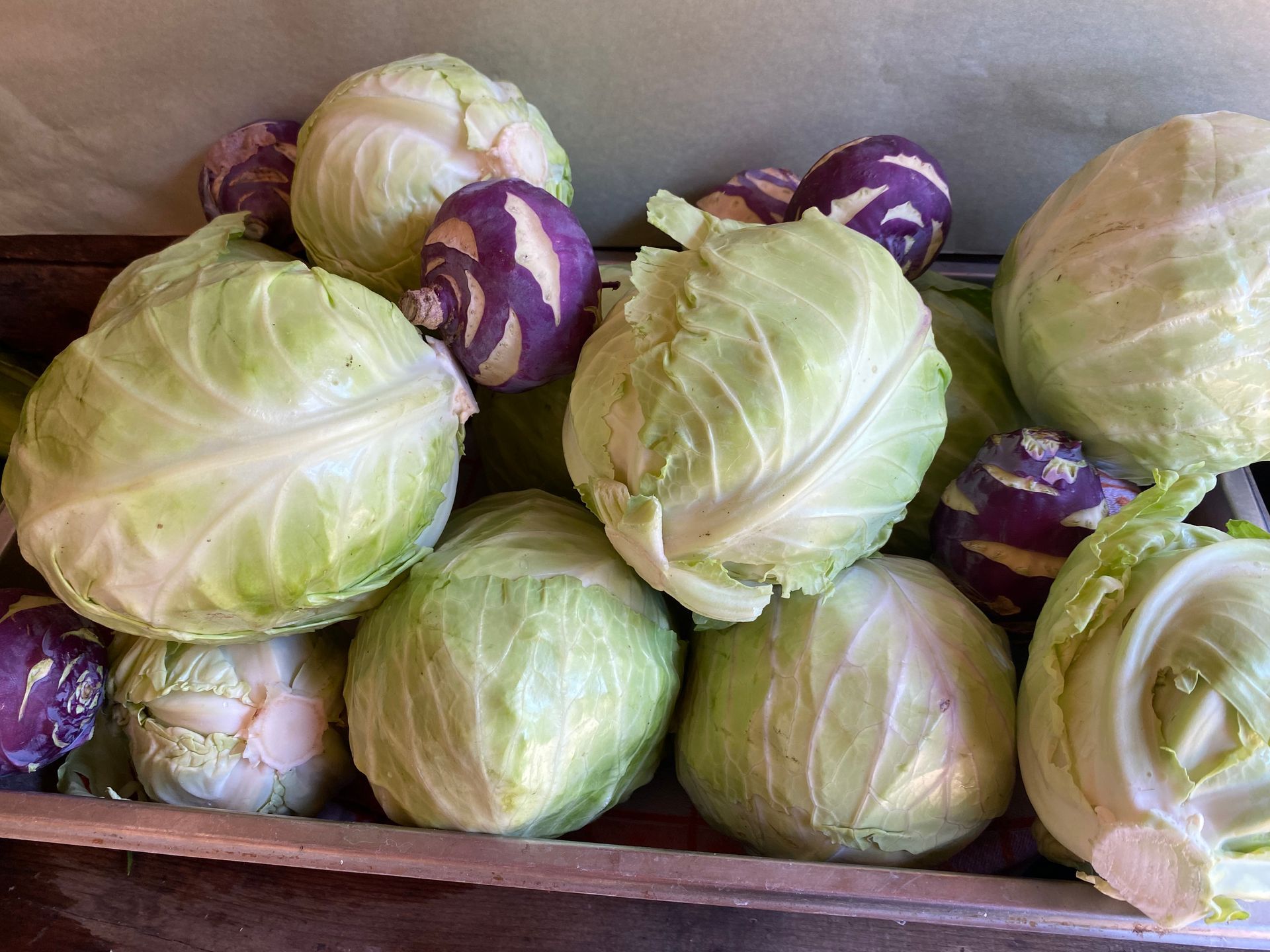 Green and purple cabbage in a basket