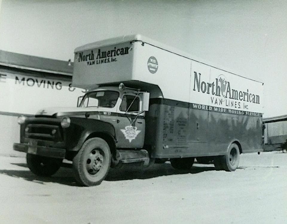 Black-and-white photo of a North American Van Lines moving truck parked