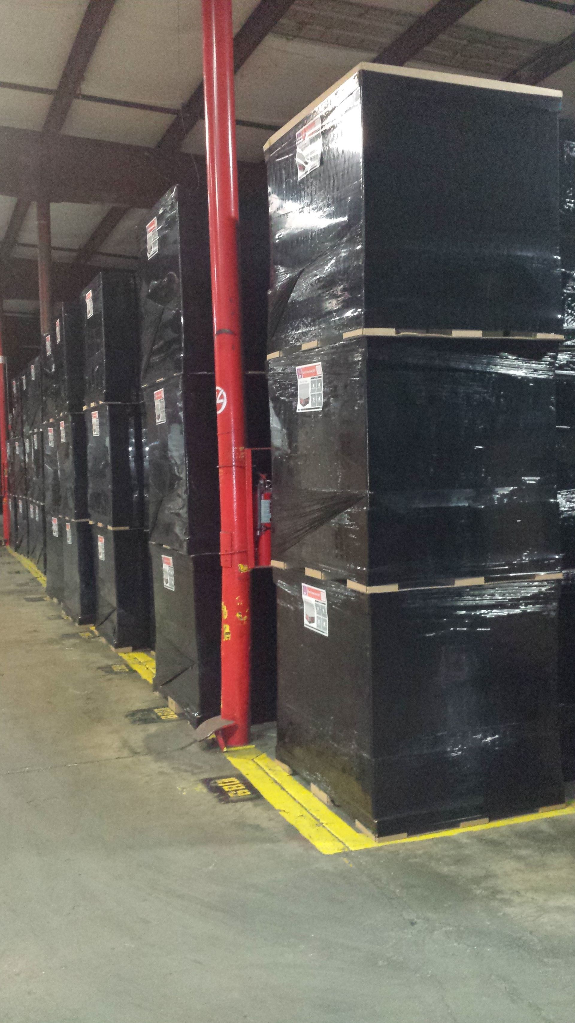 Close-up of stacked retail shipments on corrugated pallets with double-wall top decks, prepared for seasonal distribution.