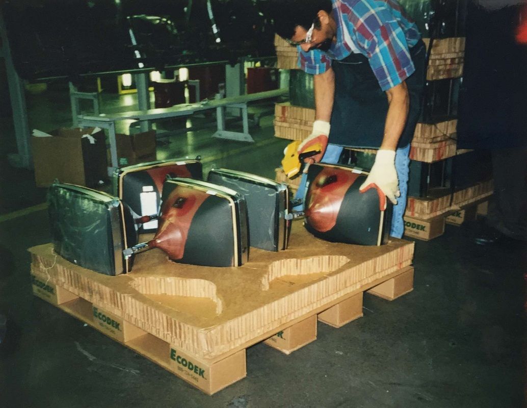 Televisions packaged for shipping on a custom corrugated pallet.