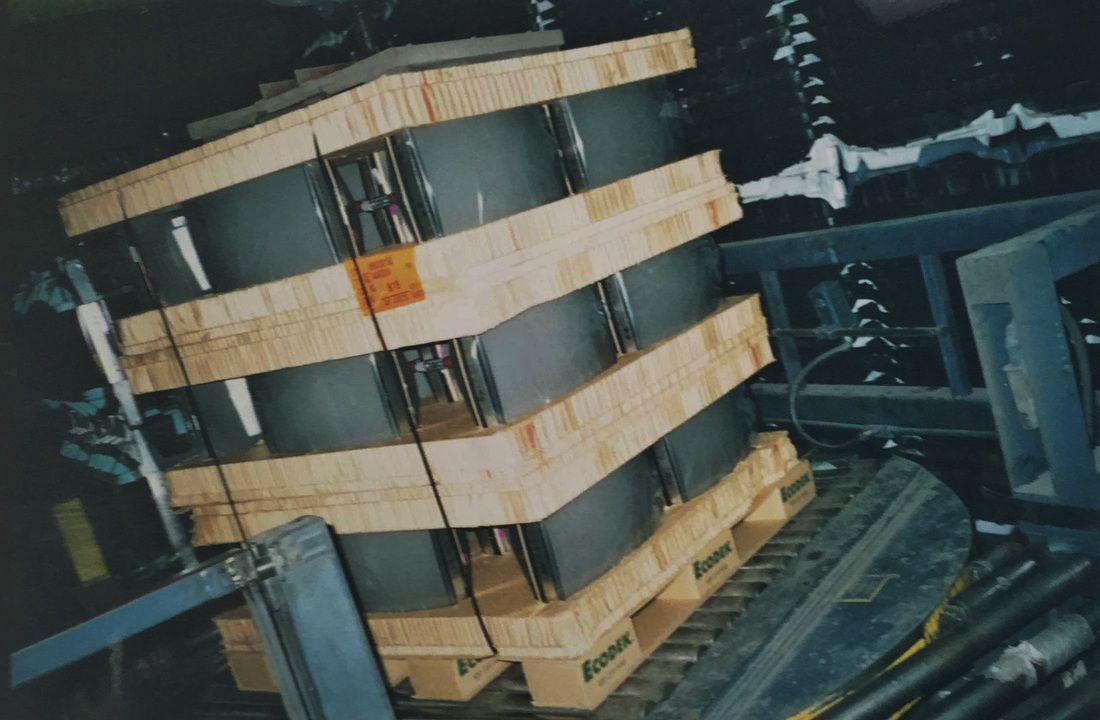 Televisions packaged for shipping on a custom corrugated pallet.