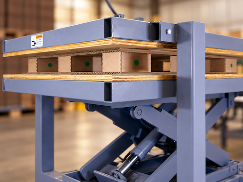 Industrial press table compressing corrugated pallet during production
