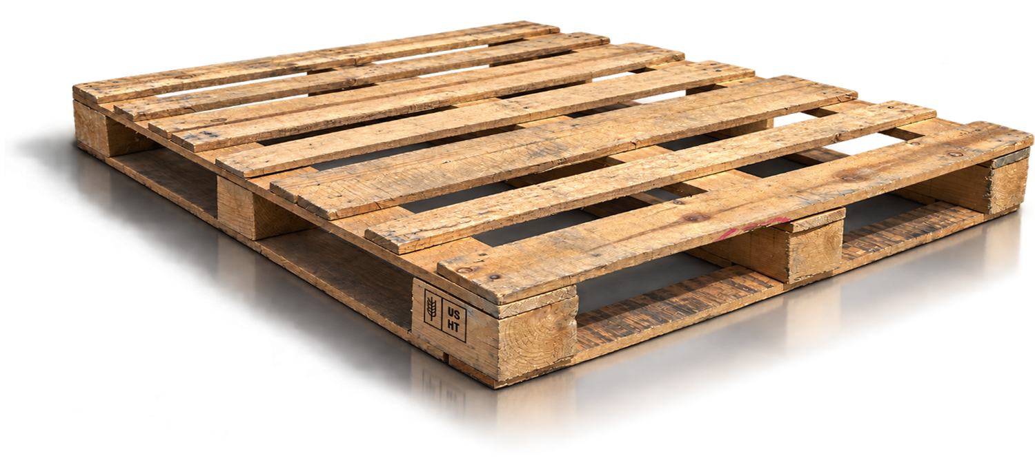 Wood shipping pallet resting on a warehouse floor.