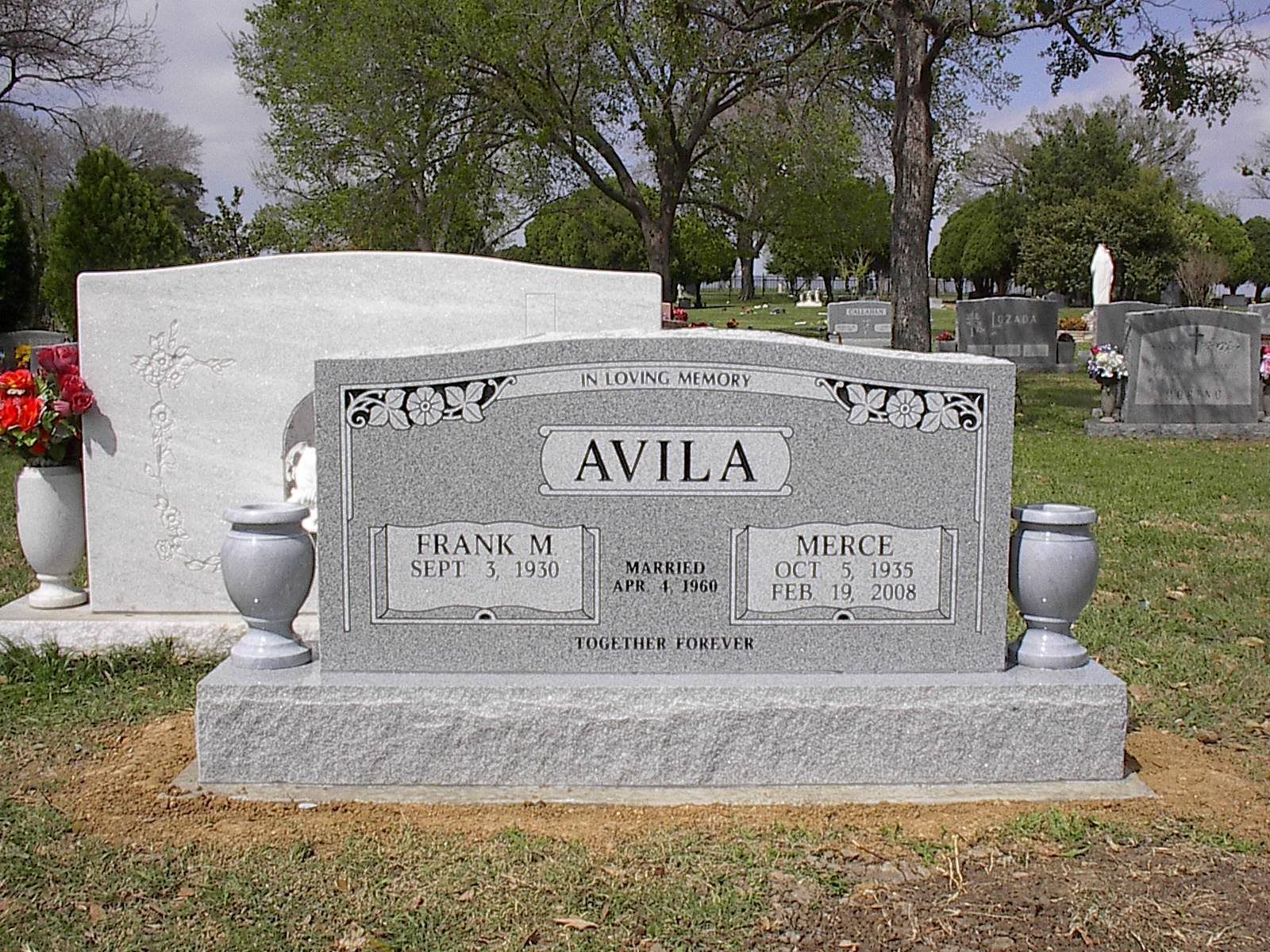 Gray granite headstone marked