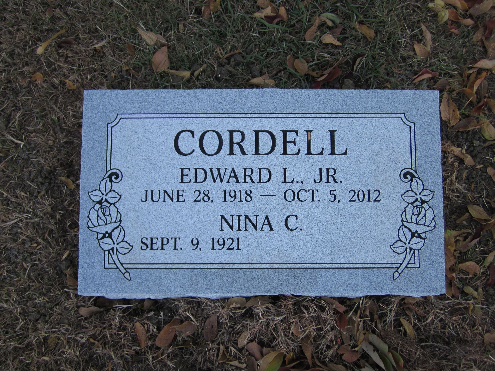 Gray headstone, inscribed 
