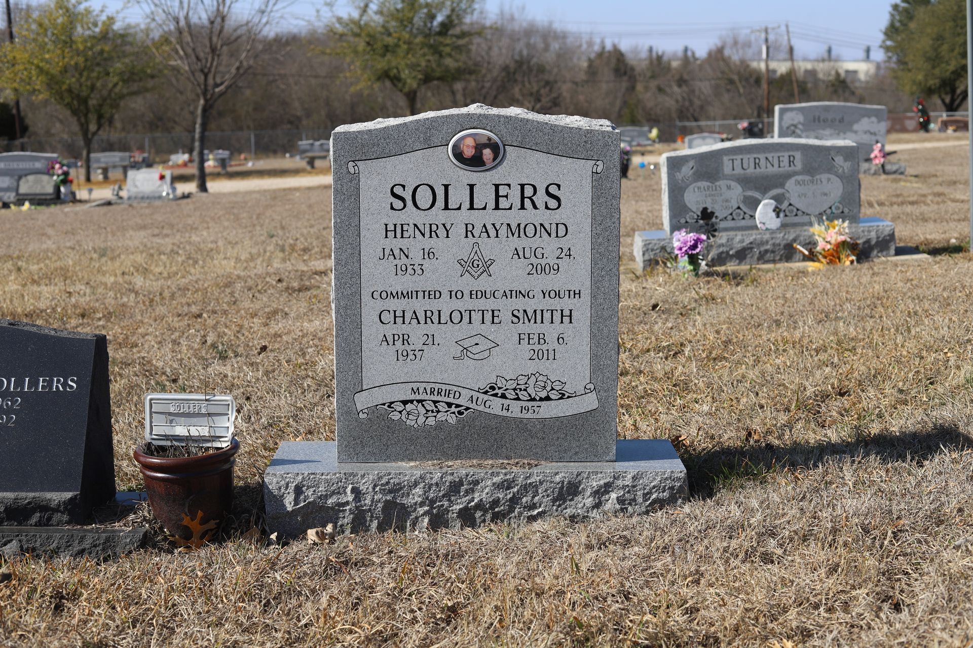 Gray headstone in a cemetery with