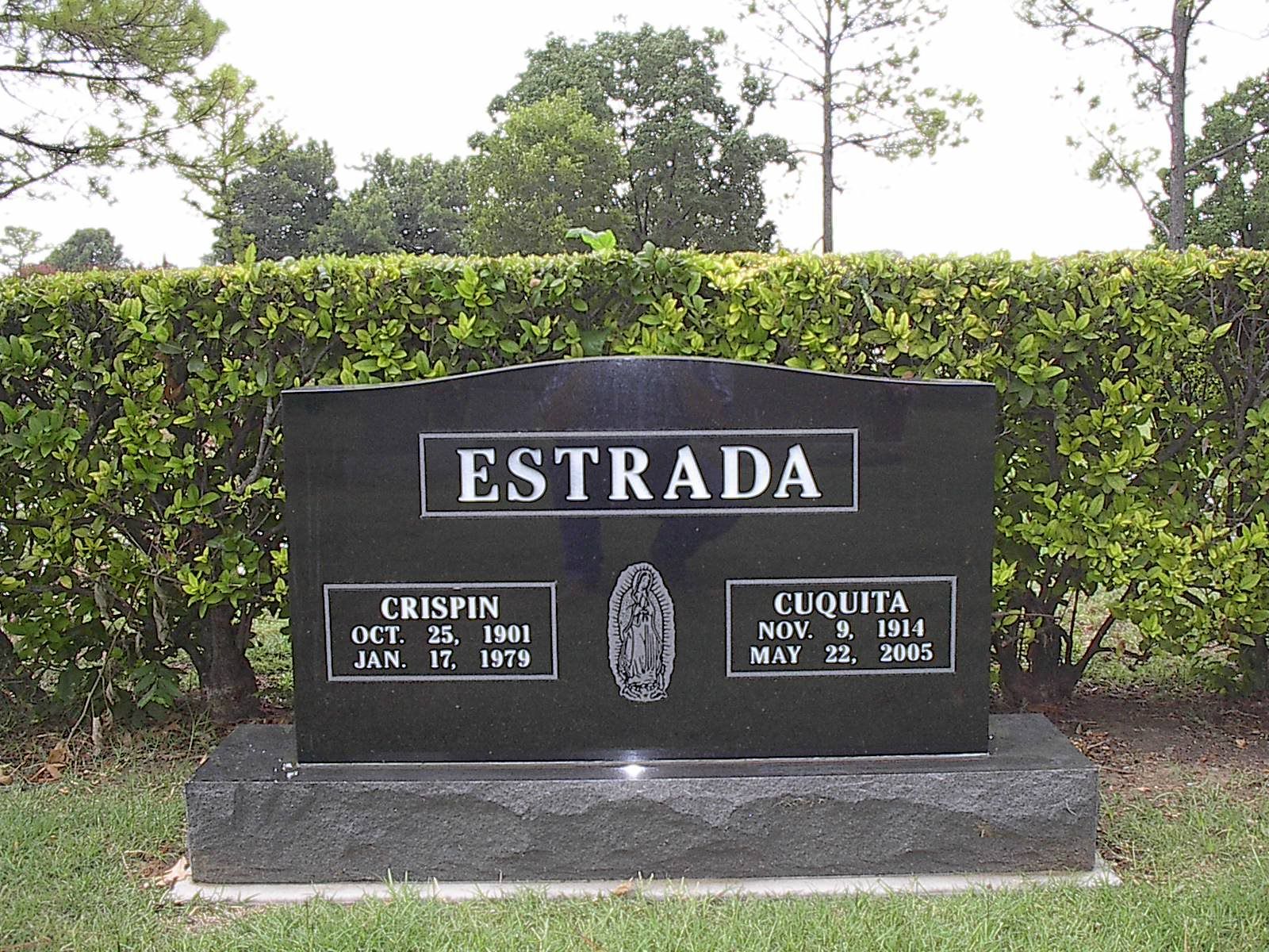 Black granite headstone inscribed with
