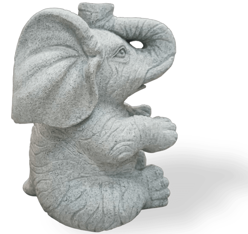 Gray stone elephant statue sitting with trunk raised.