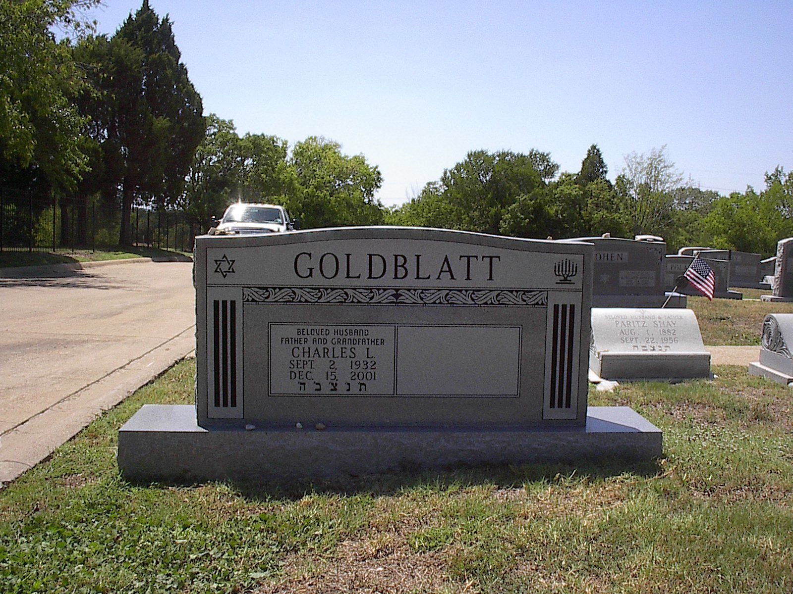 A Goldblatt family headstone in a cemetery with a Star of David emblem.