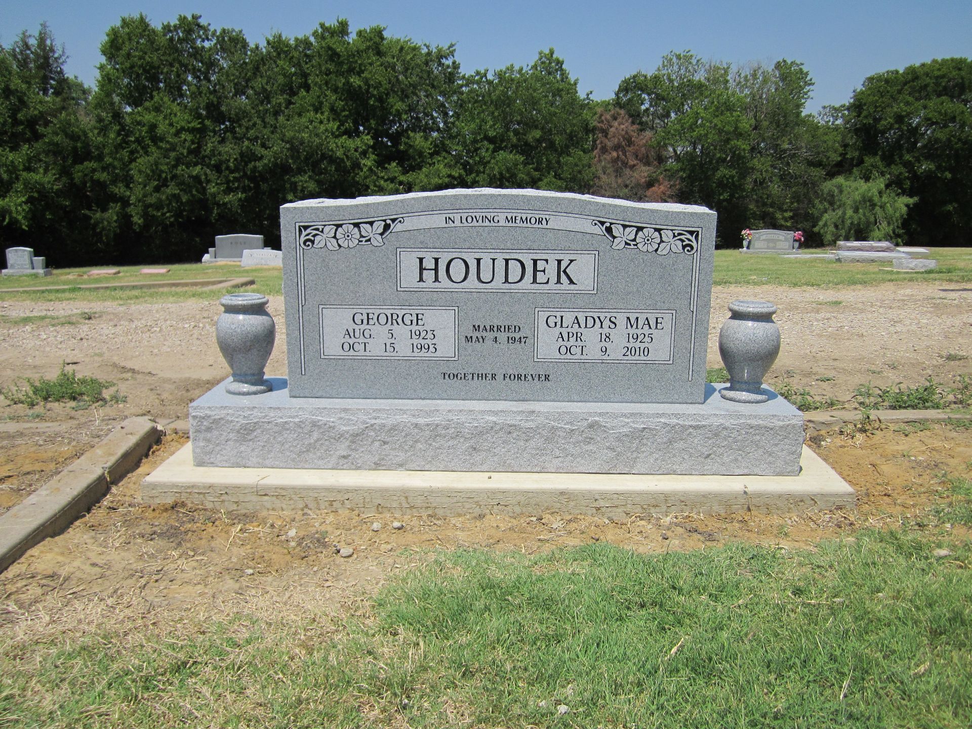 Gray granite tombstone with