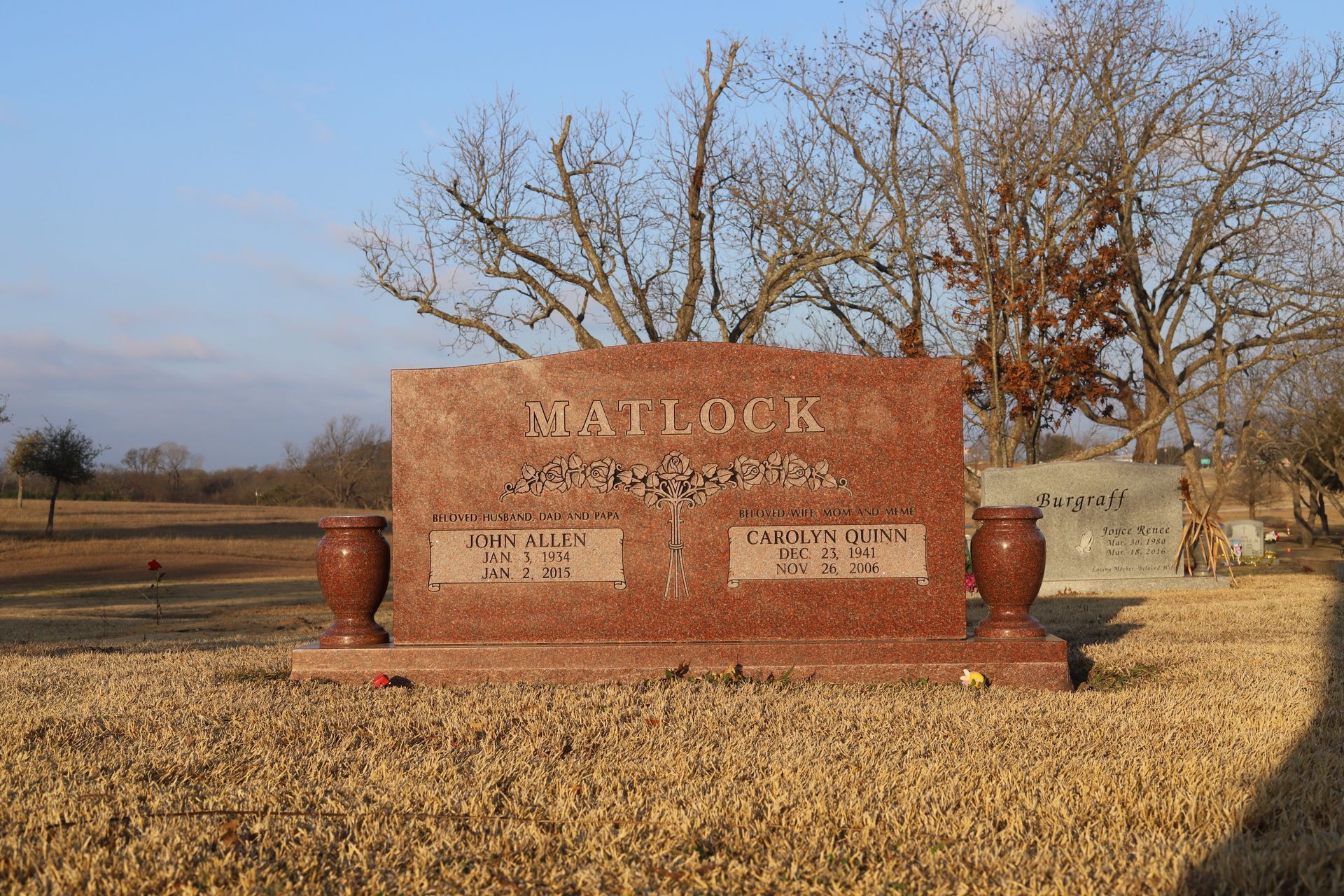 Red granite Matlock family headstone in a cemetery.