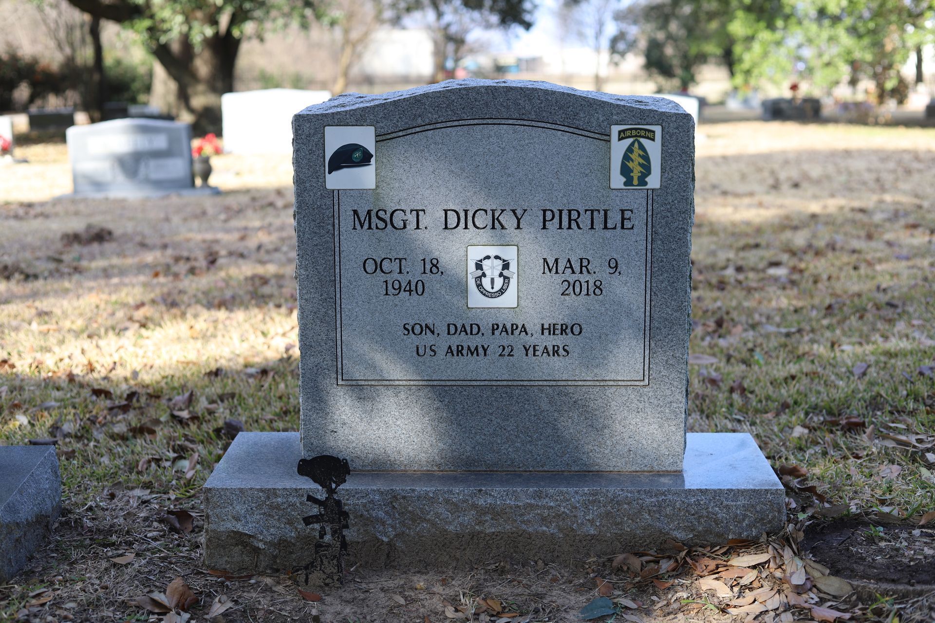 Gray headstone with military insignia, bearing the name MSG Dicy Pirtle, dates 1942-2016, and