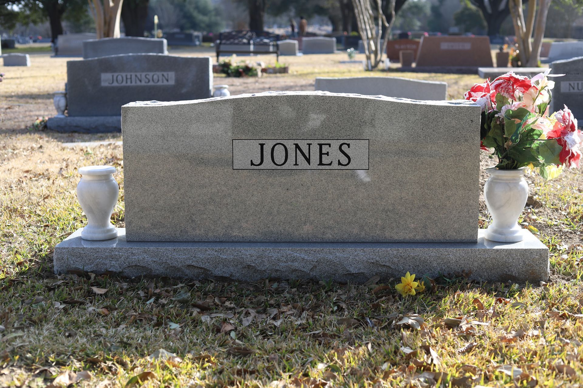 Gravestone in a cemetery, with the name