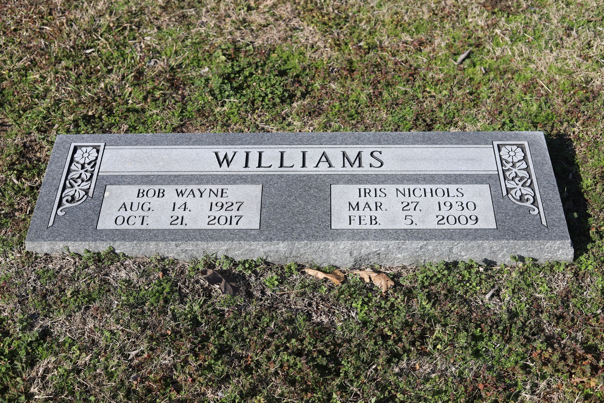 Gray headstone with the name WILLIAMS and two sets of birth/death dates: Bob Wayne, 1927-2017, and Iris Nigancas, 1930-2009.