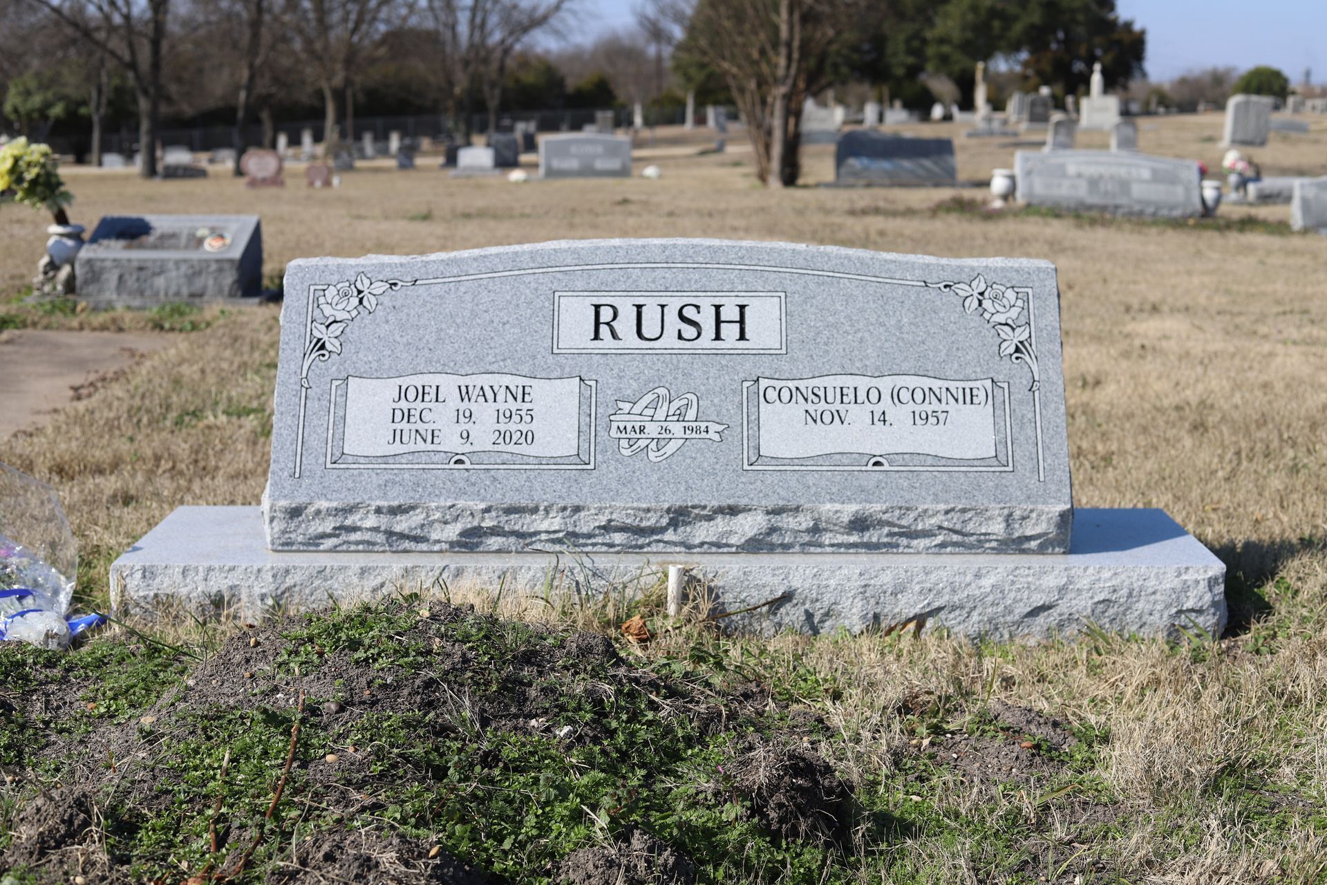 Gravestone in a cemetery, featuring the name
