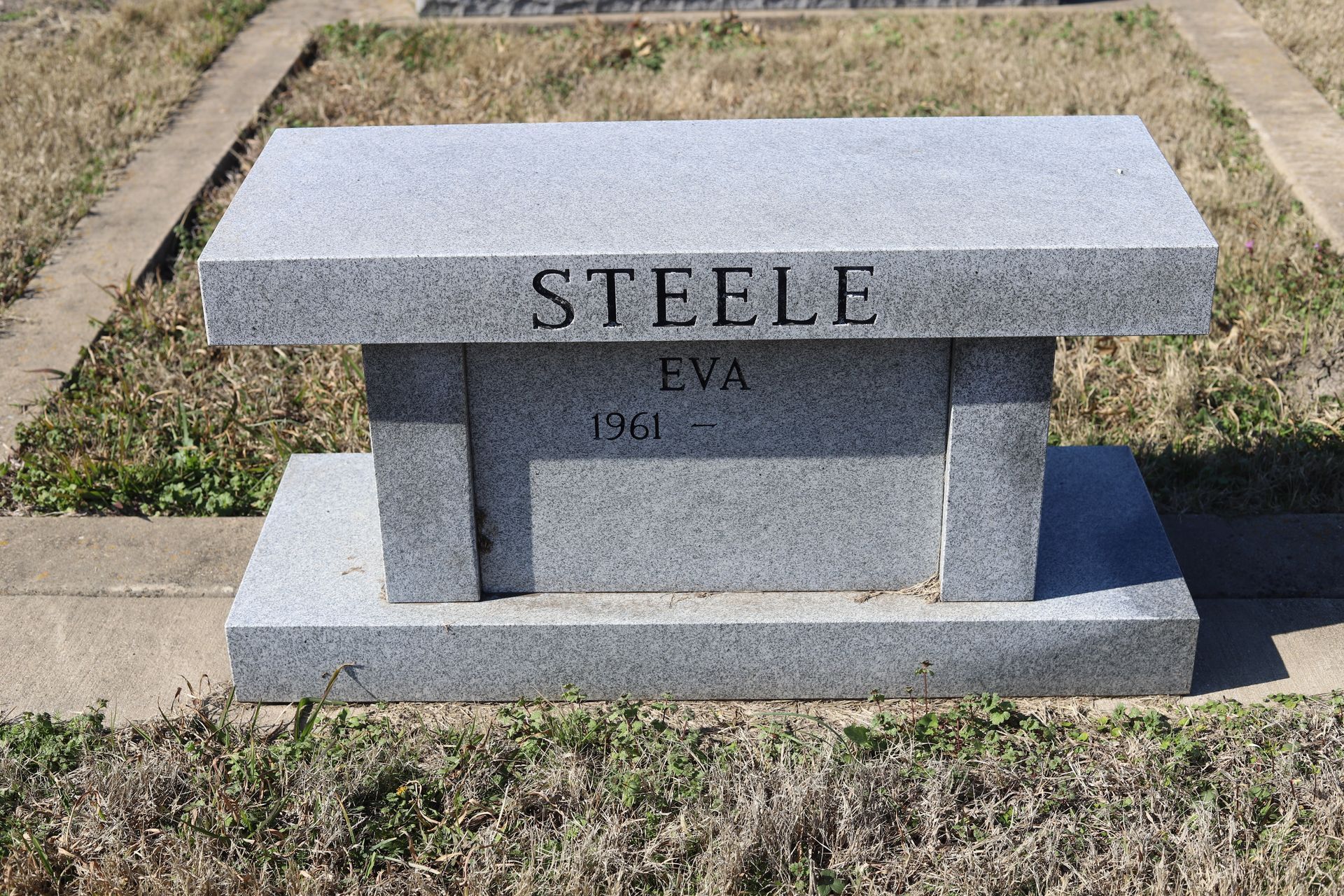 Gray granite tombstone; 