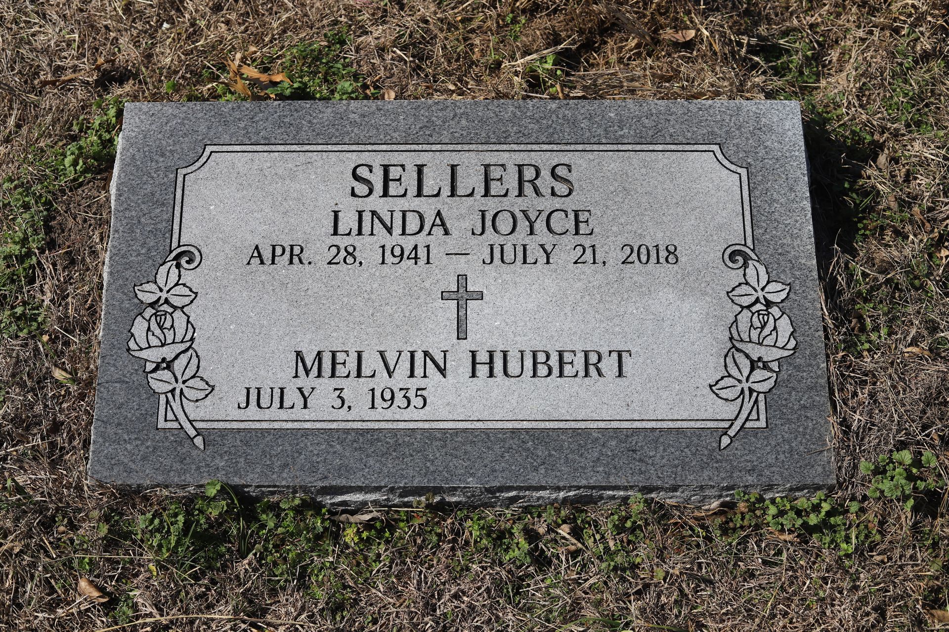 Gray headstone engraved with 