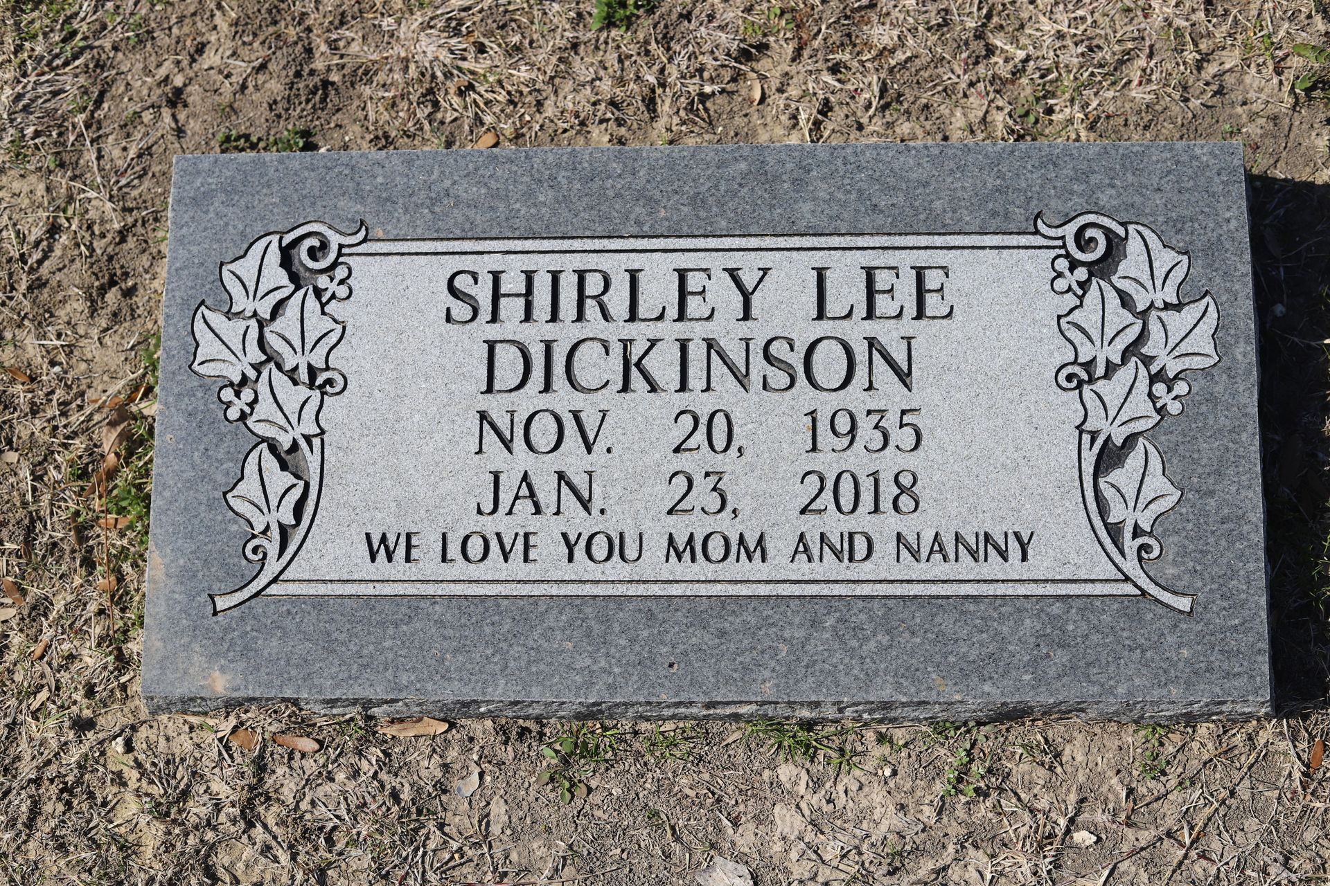 Gray headstone engraved with 