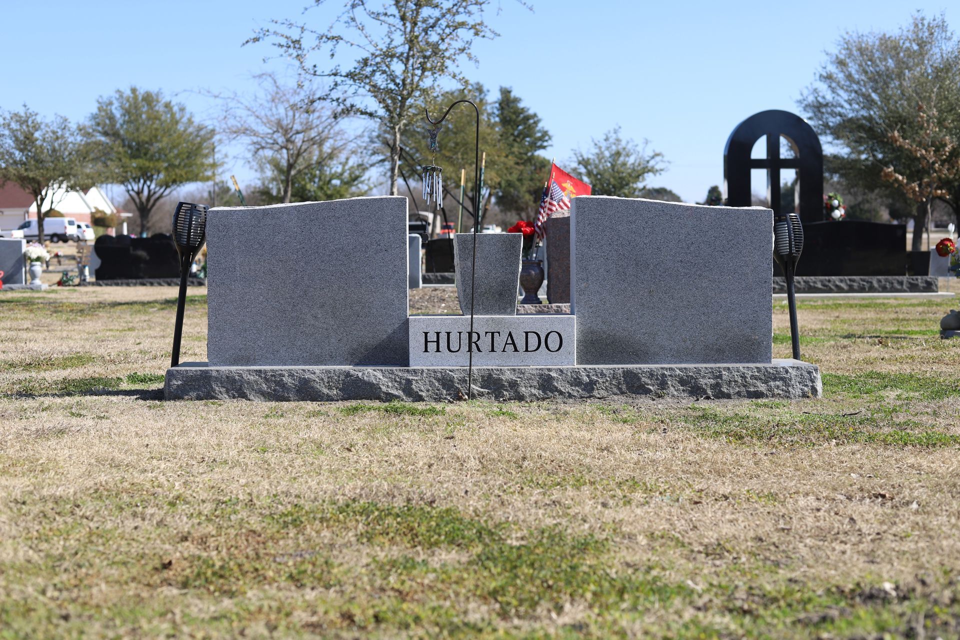 Two gray tombstones with the last name 
