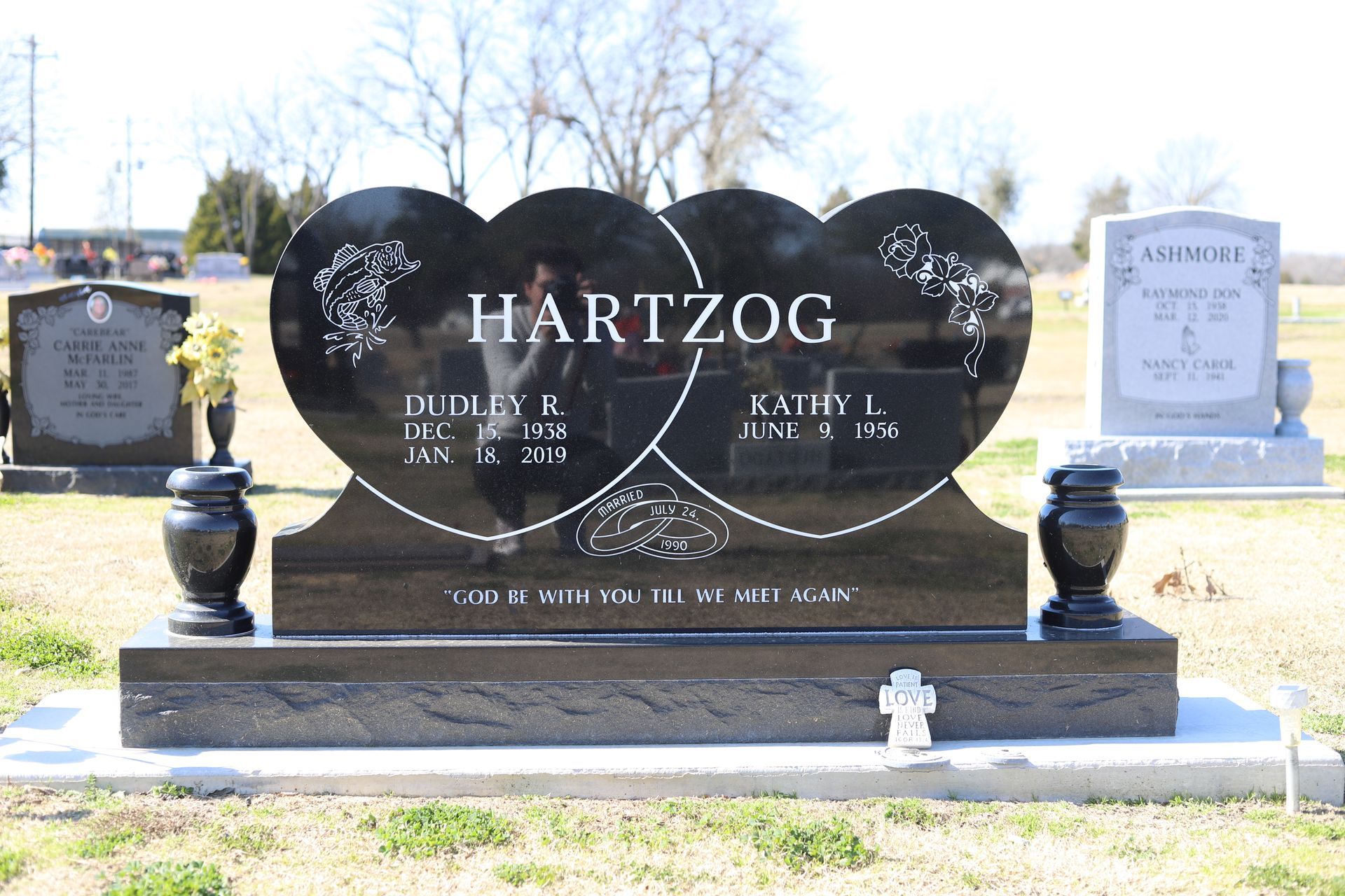 Black heart-shaped headstone with 