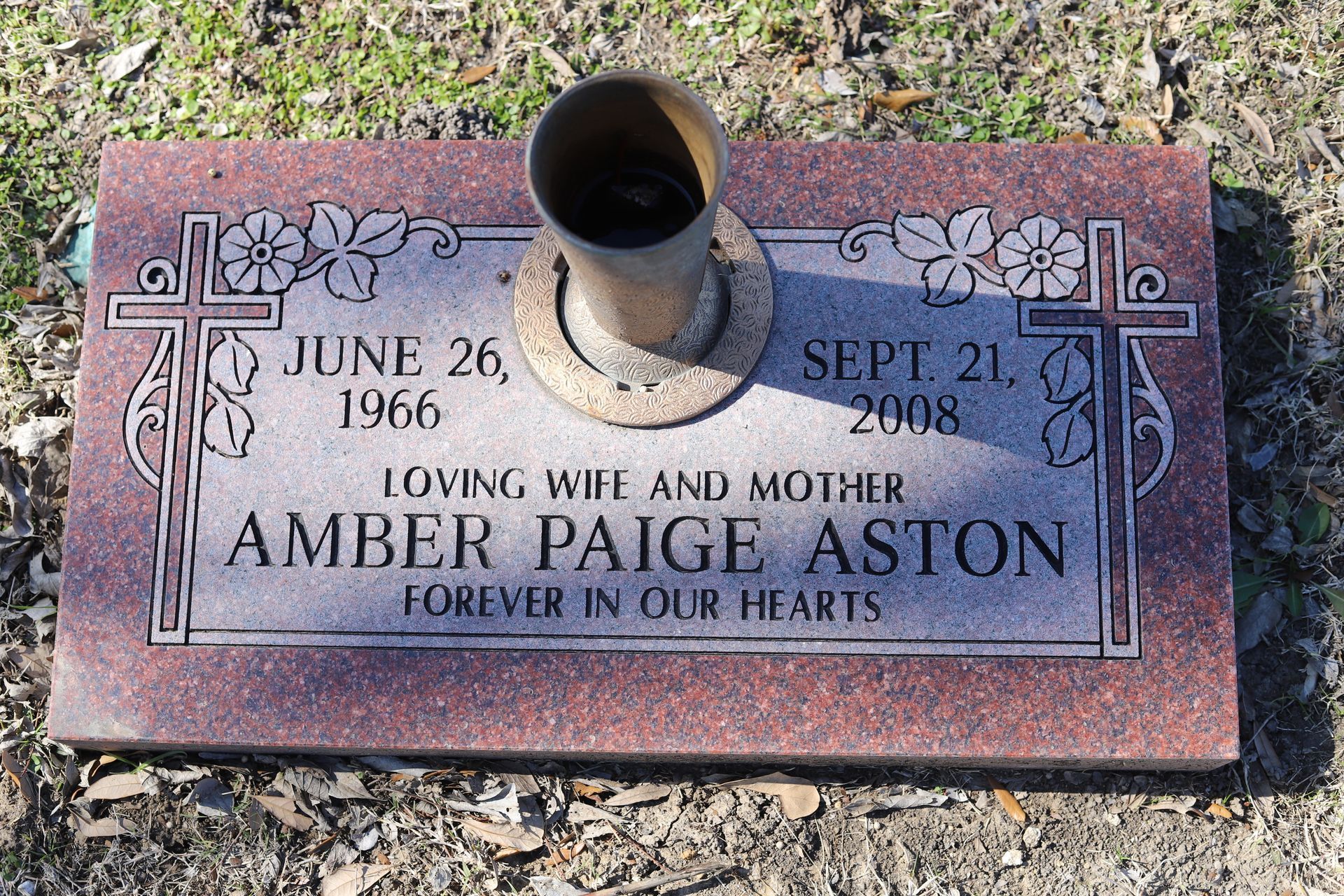 Headstone for Amber Paige Aston, born 1966, died 2008. Text includes 