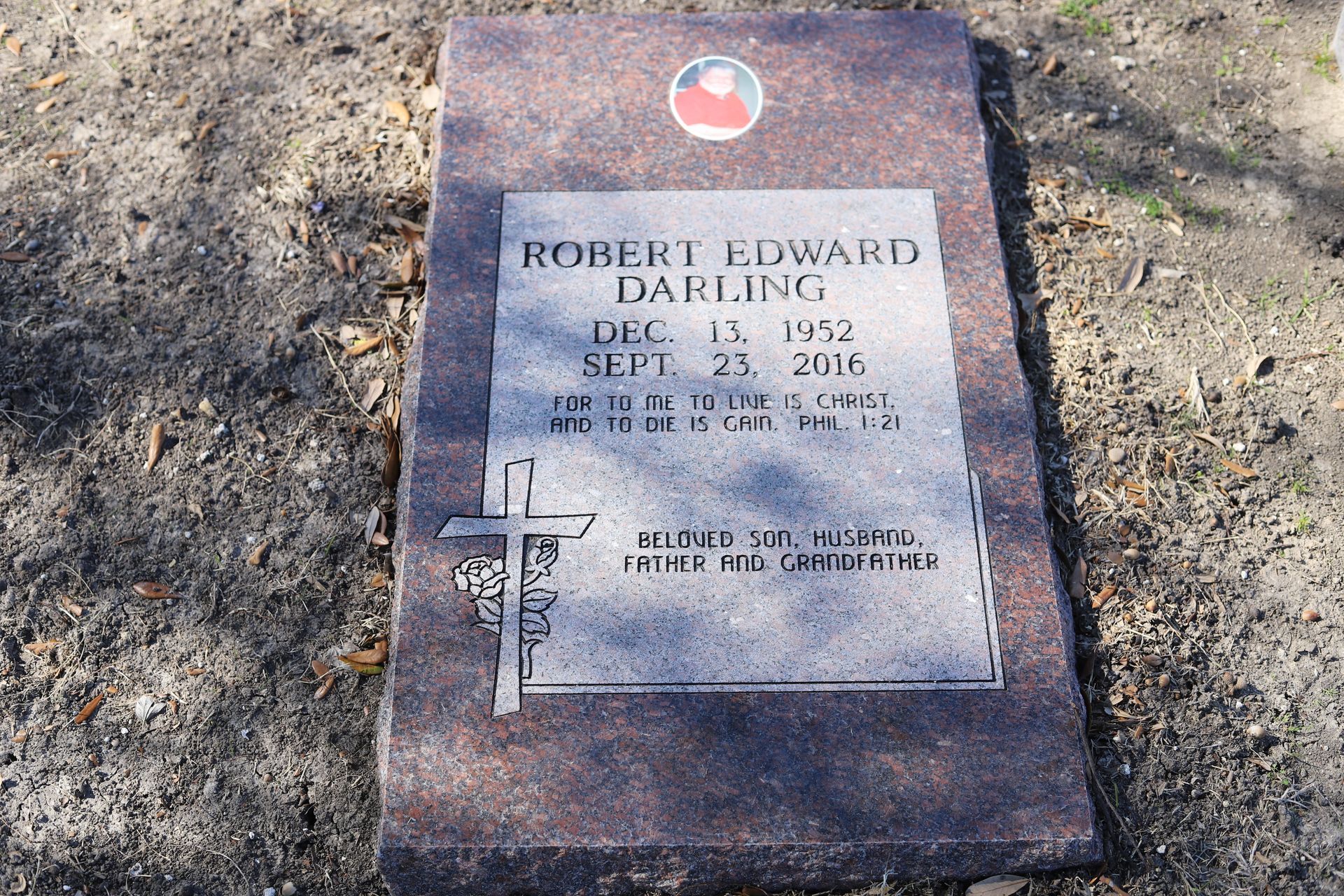 Headstone for Robert Edward Darling: dates Dec 18, 1952 - Sept 23, 2016, with cross and image.