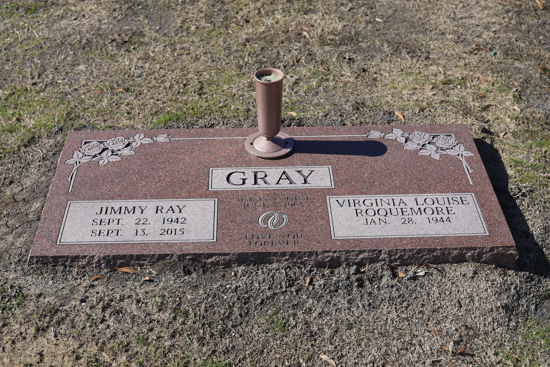 Red granite headstone with 