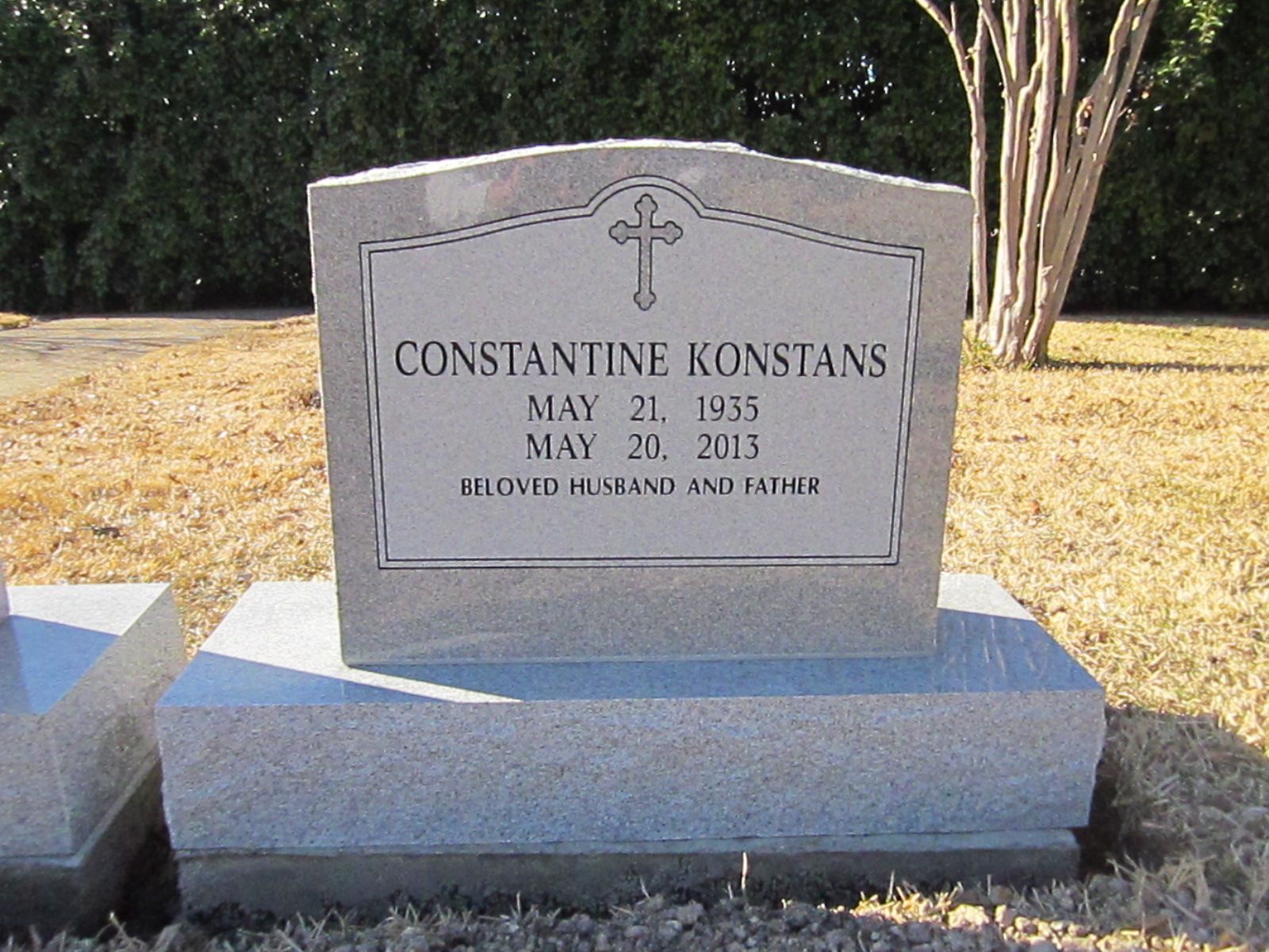 Gravestone of Constantine Konstans, with dates May 21, 1935 - May 20, 2013, in a cemetery.