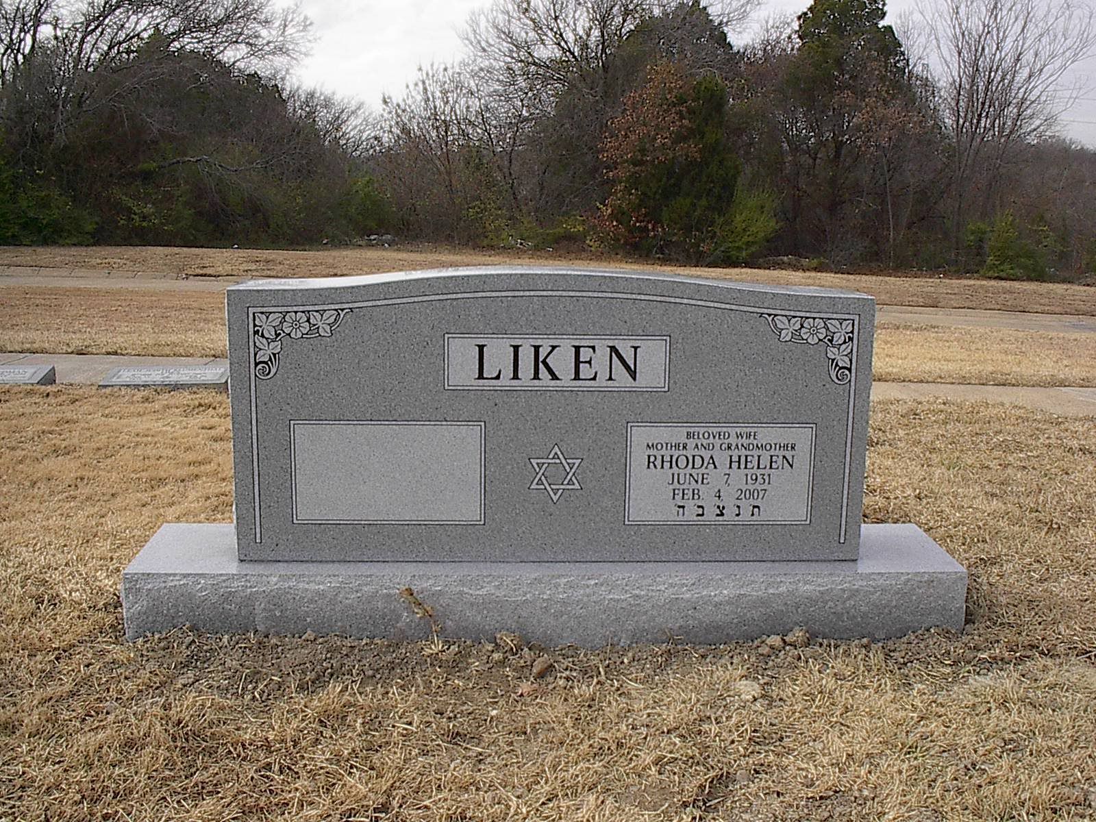 Gray headstone in a cemetery; name LIKEN on top; other names and dates visible.