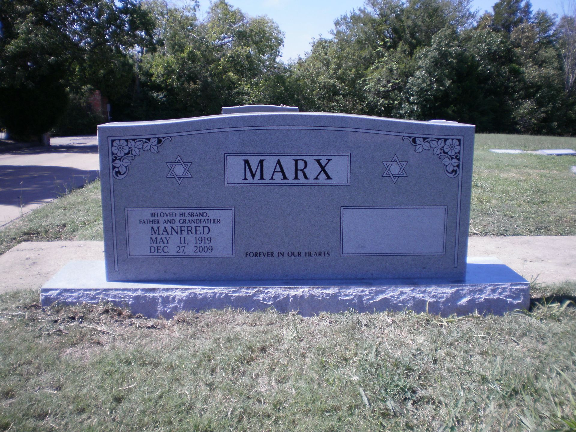 Gray granite headstone marked