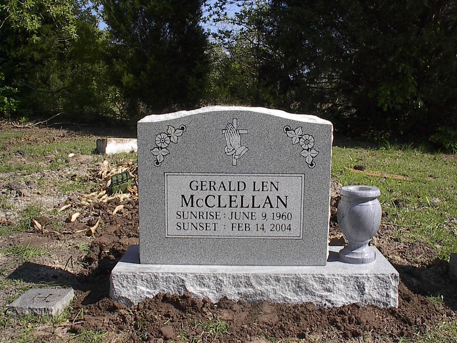 Gravestone for Gerald Len McClellan in a cemetery.