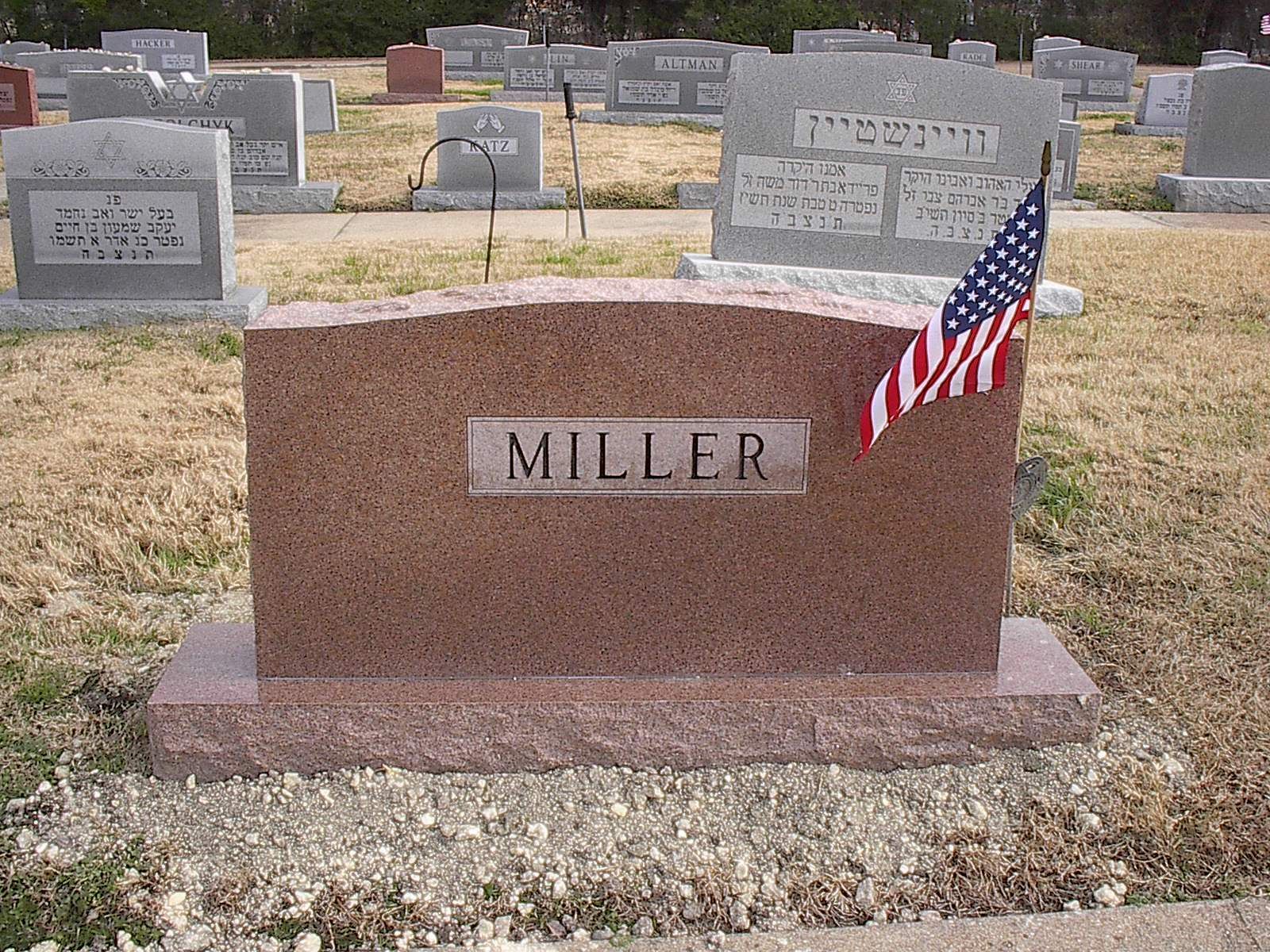 Red granite tombstone with