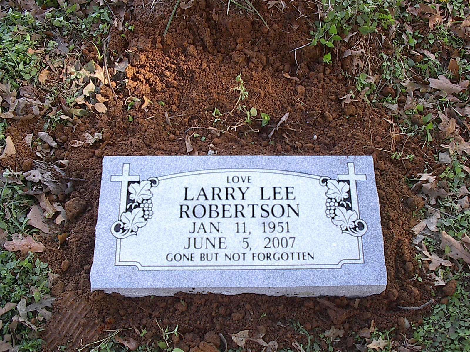 Grave marker: Larry Lee Robertson, born January 11, 1951, died June 5, 2007. Text: 