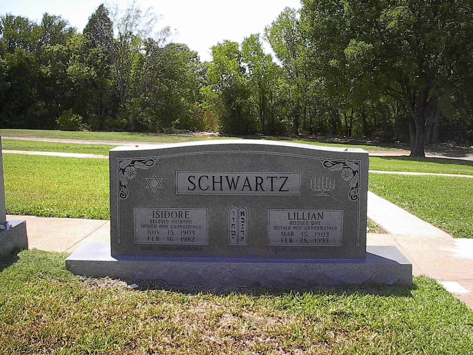 Gray Schwartz family headstone in a grassy cemetery setting.