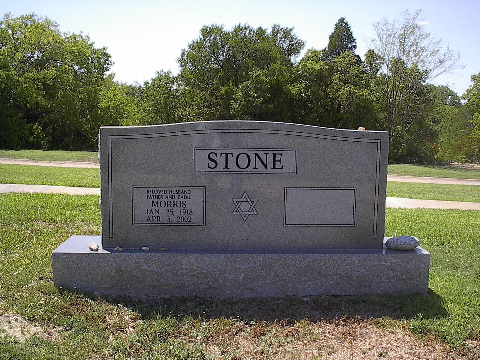 Gray headstone in a cemetery with
