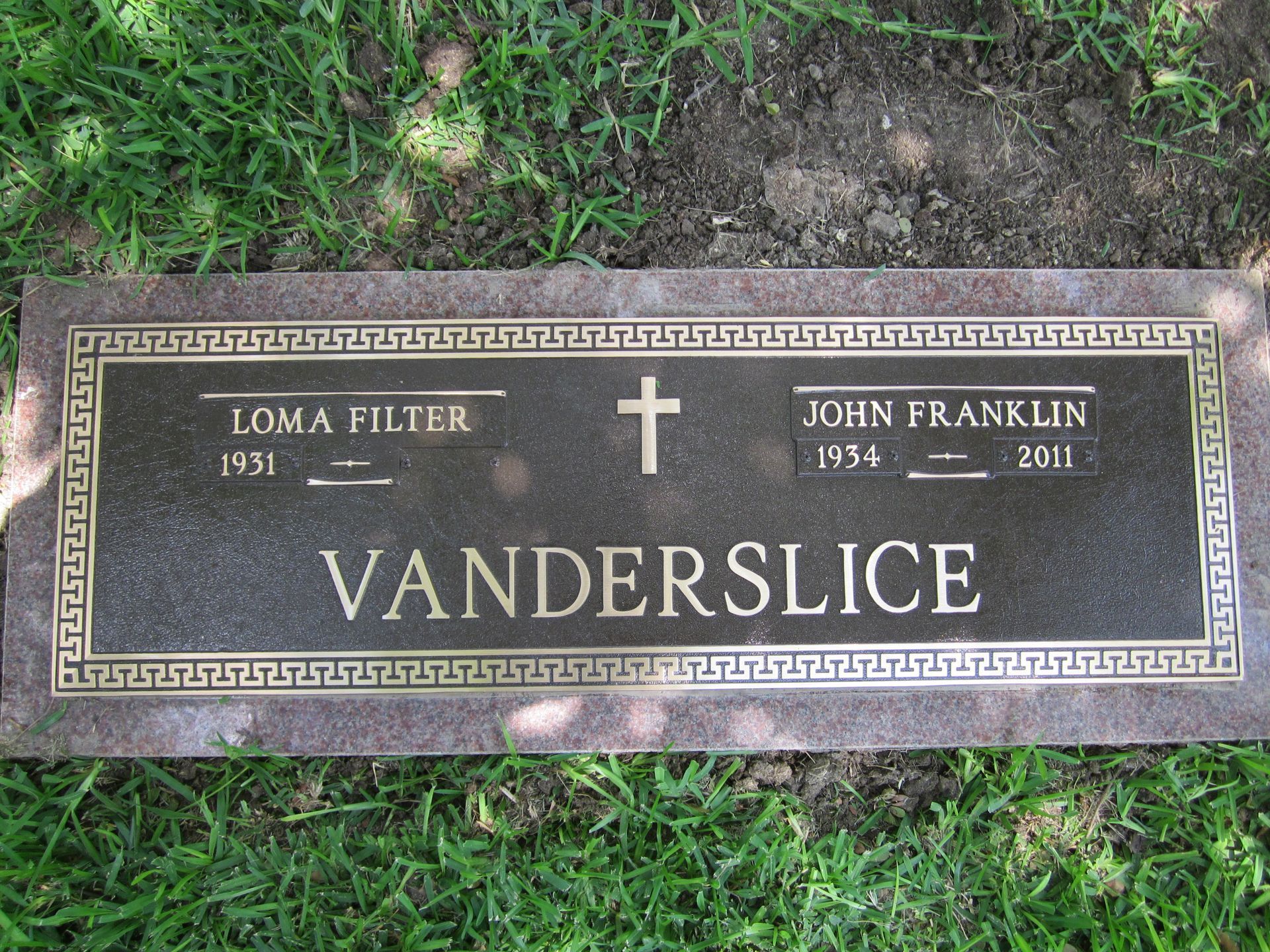 Bronze tombstone with names 